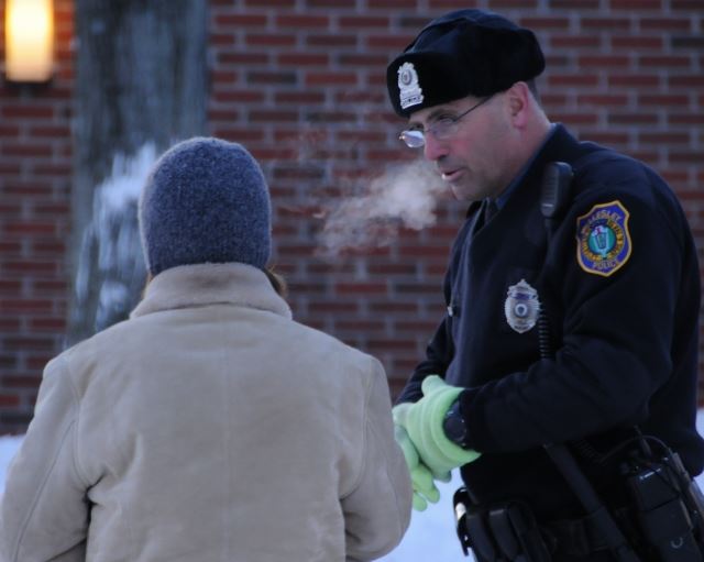 Officer Amalfi assists a resident during a bitter cold morning.