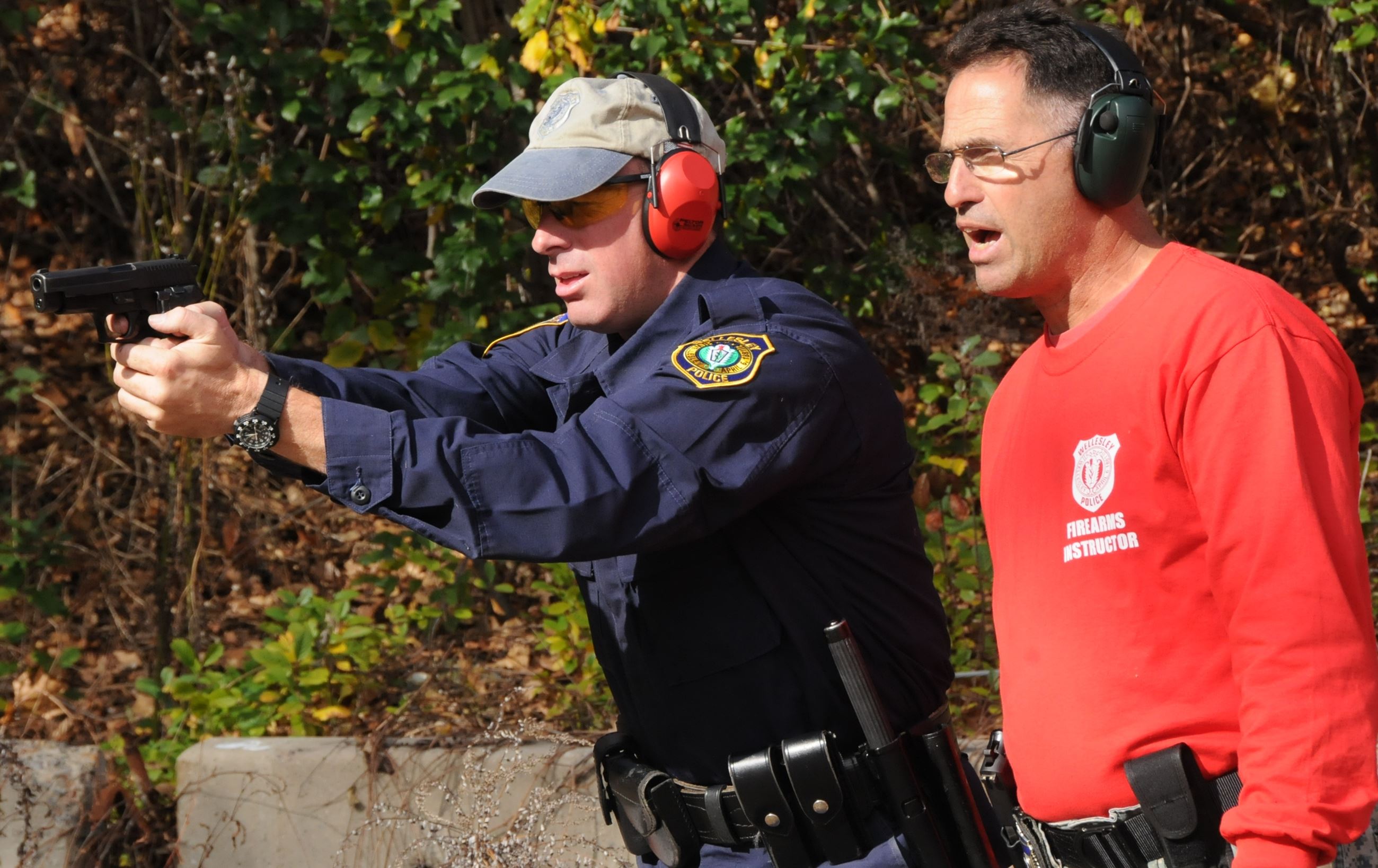 Officer Tim Gover gets some one on one instruction during firearms training from Officer Jim Amalfi.
